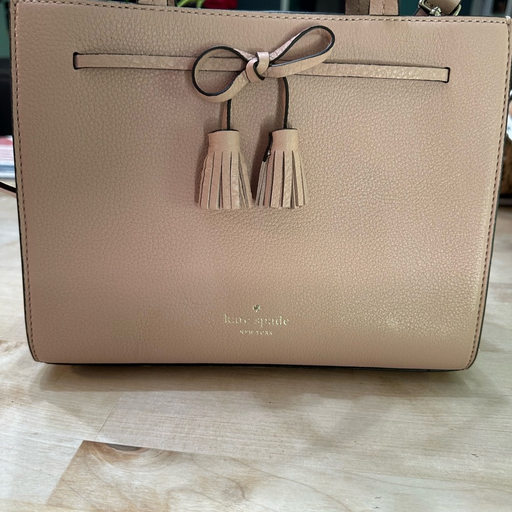 Authentic Brand new Kate Spade ♠️ small handbag with strap or handles.